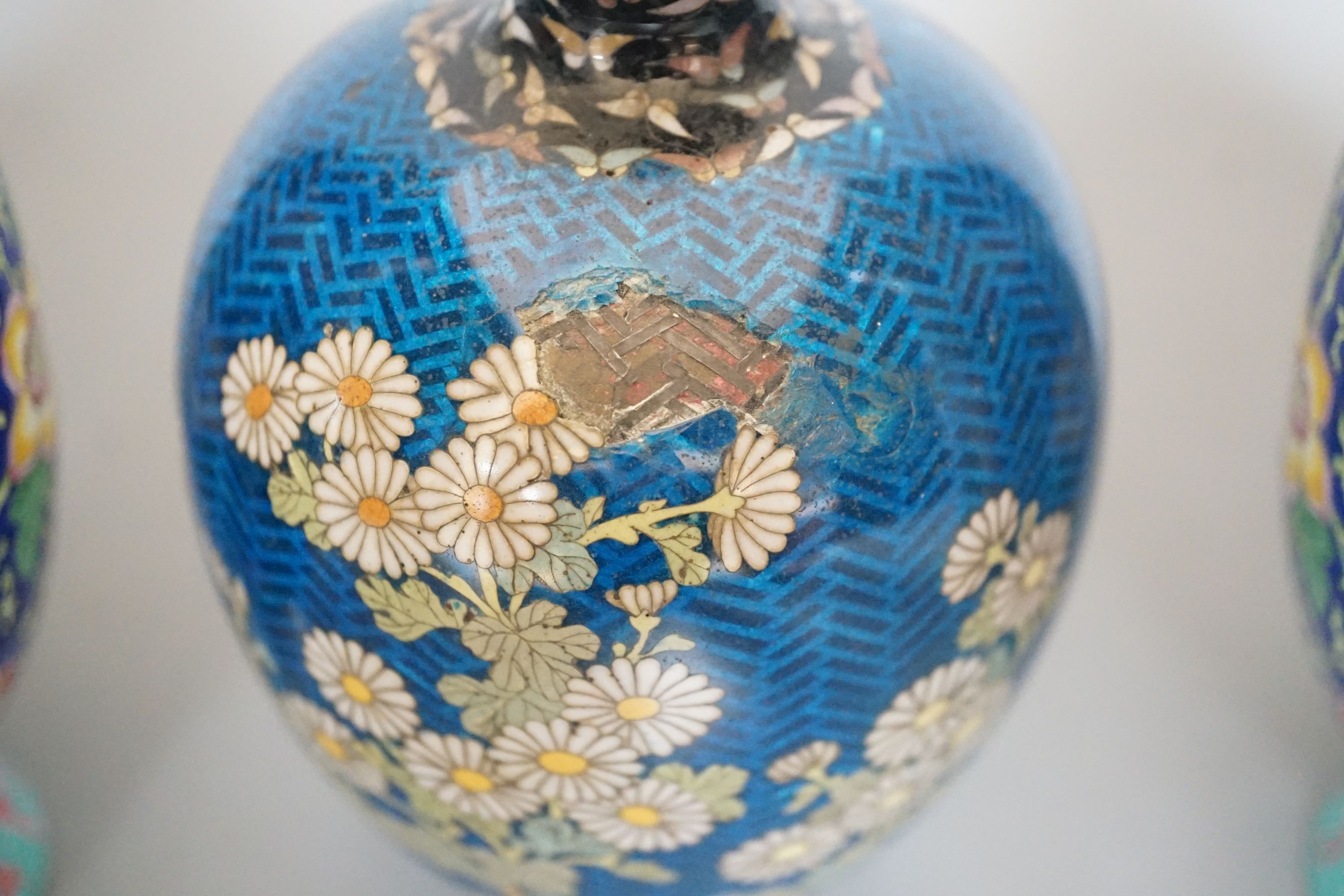 A Japanese floral cloisonné enamel vase, 13cm tall, together with two Canton enamel vases